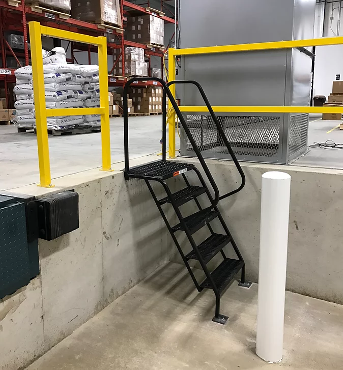 Industrial warehouse loading dock with a black EGA H-Series stairway
